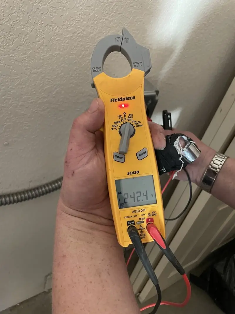 Voltage testing with clamp meter during Ceiling Fan Installation in Hapeville